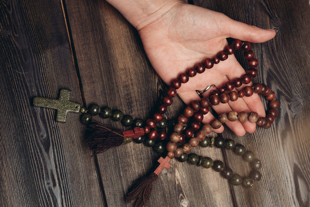 beads with orthodox cross wooden background catholicism christianity - Foto, Imagen