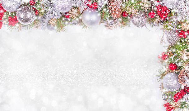 Різдвяна картка. Fir Branches, Silver Balls and Snowfall on Holiday Background - Фото, зображення