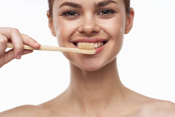 cheerful woman with bare shoulders toothbrushes hygiene oral care - Foto, Imagem