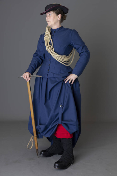 A Victorian woman wearing a mountaineering ensemble - Фото, зображення