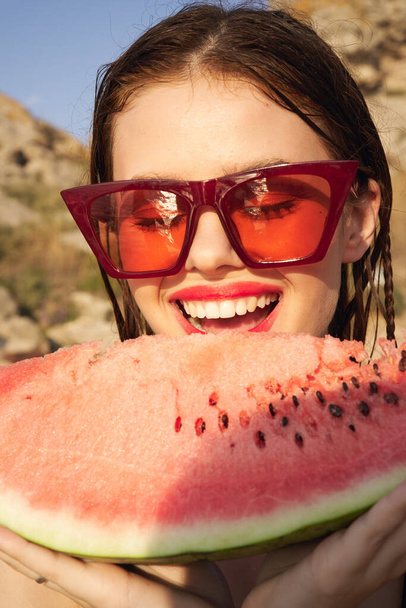 woman eating watermelon outdoors Sun summer close-up - Φωτογραφία, εικόνα
