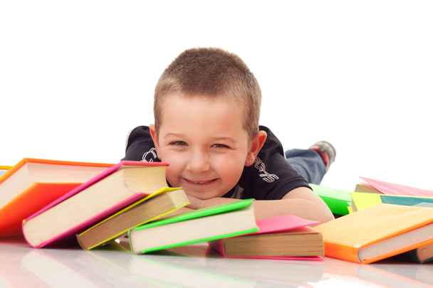 Preschooler with pile of books - 写真・画像