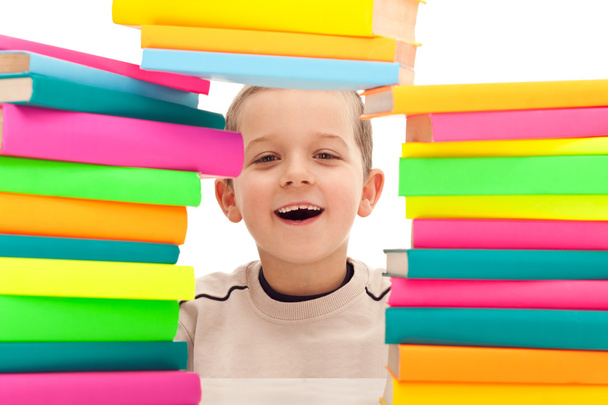 Boy behind pile of books - Φωτογραφία, εικόνα