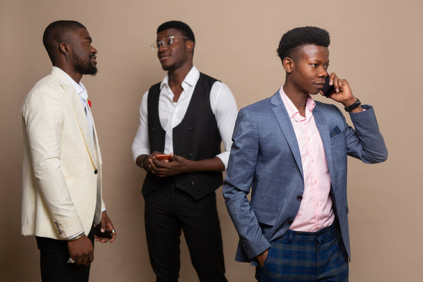 three african men in suits with mobile phones - Photo, image