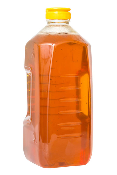 Container full of honey on a white background. - Valokuva, kuva