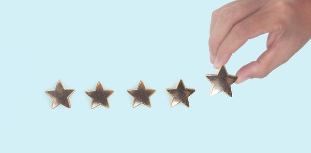 Rise on increasing five stars in human hand, Increase rating evaluation classification concept - Fotografie, Obrázek