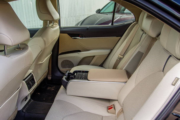 MOSCOW, RUSSIA - AUGUST 15, 2021 Toyota Camry (XV70), a mid-size sedan car model year 2021 on city background. Interior close up view. Interior details of Toyota Camry. - Foto, Bild