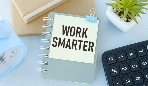 Work Smarter, craft notebook on wood table with text on paper and pen - Fotografie, Obrázek