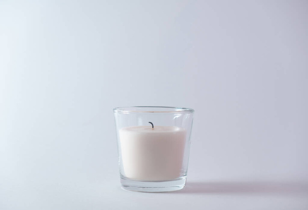 Extinguished candle on a white background. New Year's concept.Copy space - Foto, afbeelding