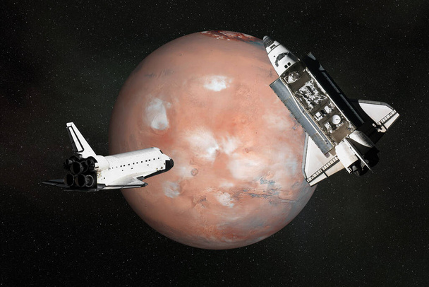 Navettes spatiales volantes près de la planète Mars avec atmosphère. Illustration de rendu 3D. Des éléments de cette image ont été fournis par la NASA - Photo, image