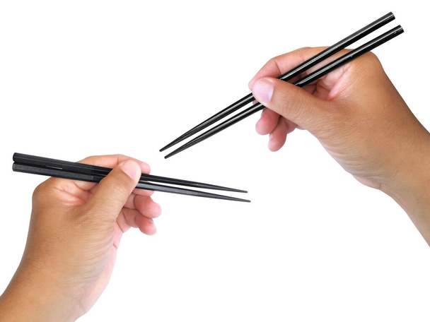Hand Holding Chopsticks Isolated on White Background - Foto, imagen