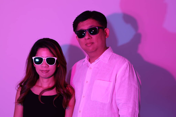 The cool  Asian couple in the gel color light photography. - Fotografie, Obrázek