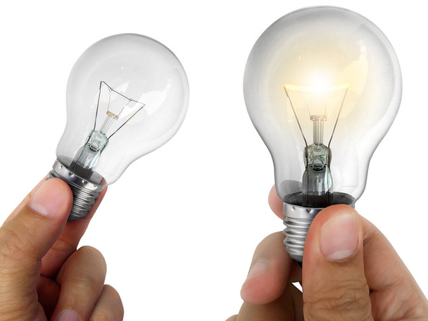 A man's hand holding an Light bulb isolated, on white background - Photo, Image