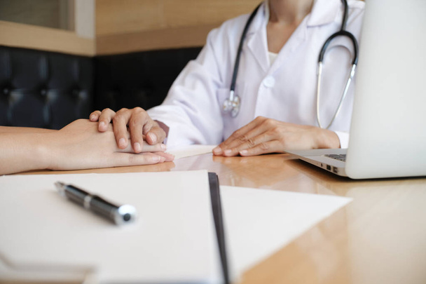 Doctor holding patient's hand, and reassuring his male patient helping hand concept - Photo, Image