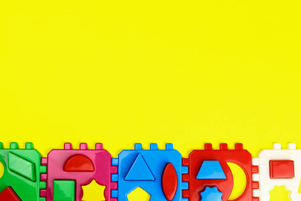 Sorter blocks, children educational toys, top view. Copy space for text - Φωτογραφία, εικόνα