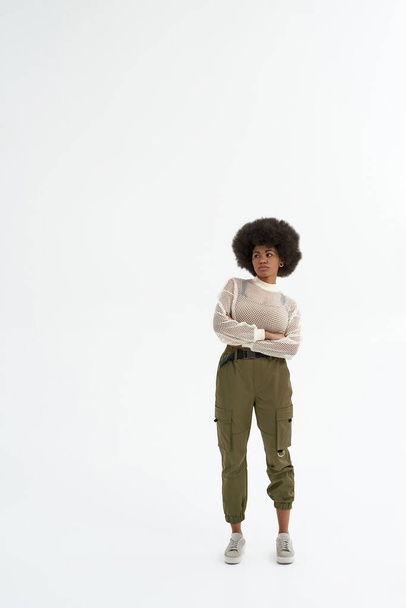 Young focused black woman with croosed arms - Photo, image