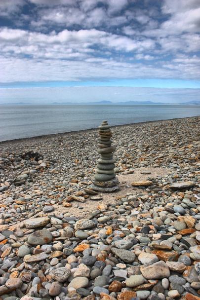 stones balancing on top of each to make a tower on a beach - Photo, Image