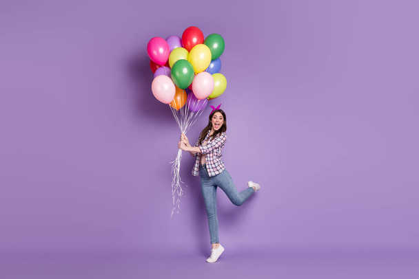 Full length body size photo overjoyed brunette girl colorful balloons pile birthday party isolated bright purple color background - Fotografie, Obrázek