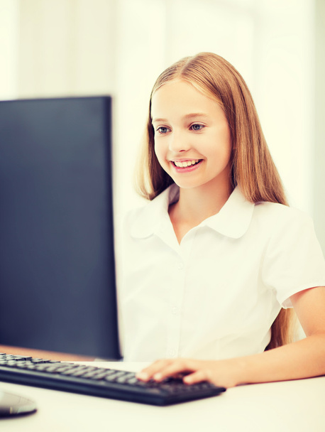 student girl with computer at school - Foto, imagen