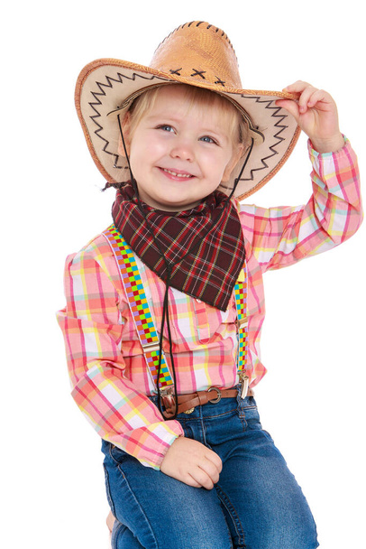 little girl dressed as a cowboy - 写真・画像