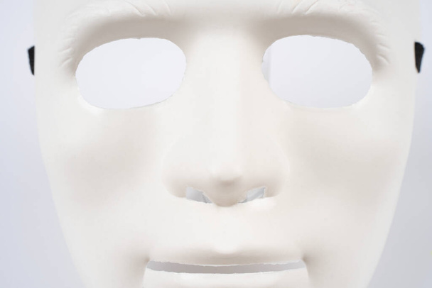 Paris, France - 11 22 2021: Packshot of Masked woman. A white undefined mask - Fotografie, Obrázek