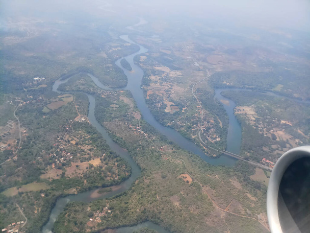 Aerial river and riverbed landscape of India, with nice white clouds in the atmosphere, image shot in the sky from aeroplane. Nature stock image. - Photo, Image