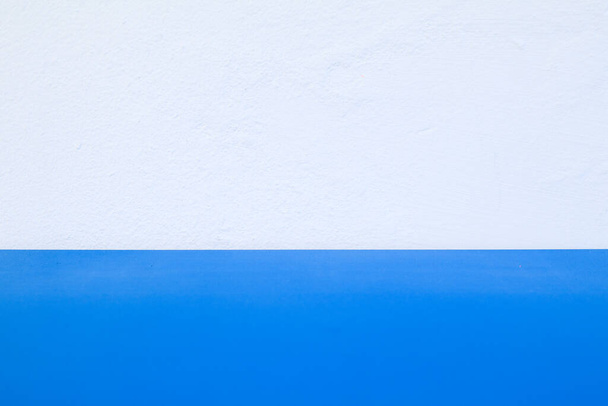 White wall with blue painting Surface background and copy space for text message on wood backdrop. Wall building Close up. Rough Surface plaster Texture With Copy Space for design - Fotó, kép