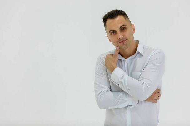 Isolated portrait close up studio shot of Caucasian happy handsome smart confident professional successful businessman entrepreneur in long sleeve shirt stand smile look at camera on white background. - Foto, Bild