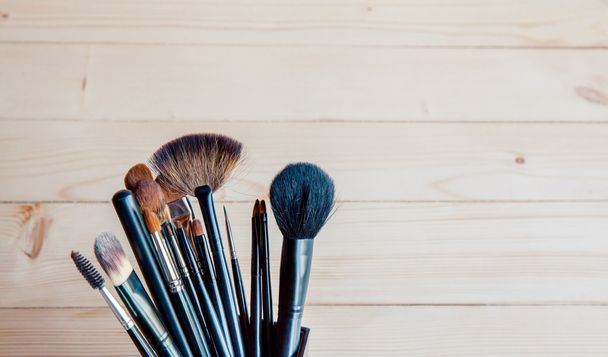make-up brushes in a black glass - Photo, Image