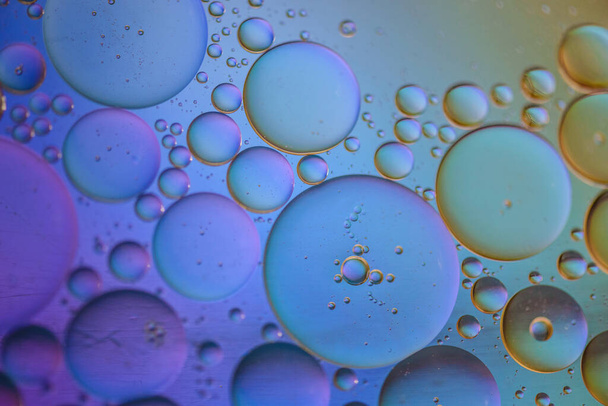 Oil drops in water. Abstract psychedelic pattern image multicolored. Abstract background with colorful gradient colors. Dof. - Фото, изображение