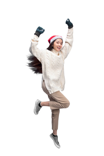 Asian woman with winter gloves and Santa hat isolated over white background - Valokuva, kuva