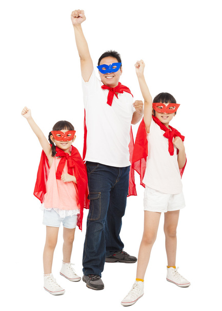 Father and daughters making a superhero pose with red cape - Photo, Image