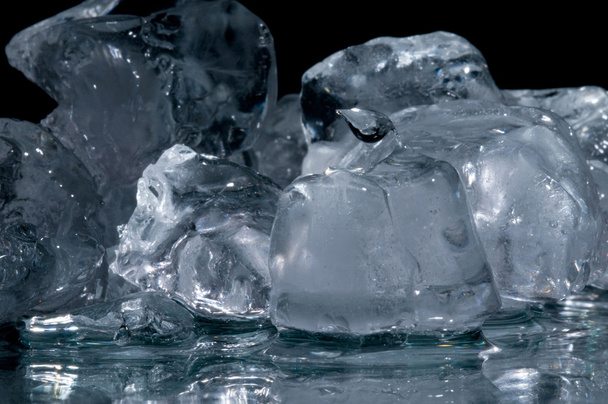 Chunks of ice lay on the ground - Zdjęcie, obraz