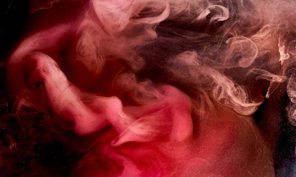 Pink smoke on black ink background, colorful fog, abstract swirling touch ocean sea, acrylic paint pigment underwater - Fotografie, Obrázek