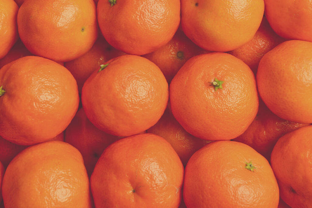 Mandarin orange background. Top view.  - Фото, изображение