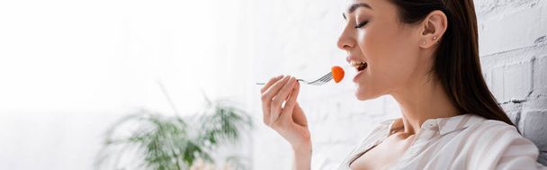 happy pregnant woman holding fork with cherry tomato, banner - Foto, Imagem