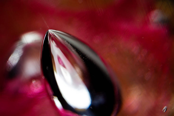 Abstract photo of red blown glass. Red and black abstract background. Extreme macro. - Foto, immagini