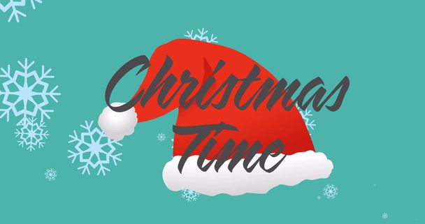 Image of christmas time text over snow falling and santa hat. christmas, winter, tradition and celebration concept digitally generated image. - Valokuva, kuva