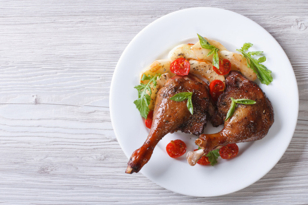 duck legs baked with apples and tomatoes  close-up top view - Photo, Image