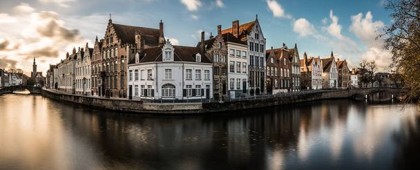 Bruges, West Flemish Region, Belgium - 11 15 2017: The Spiegelrei historical  street reflecting in the canal - Фото, изображение