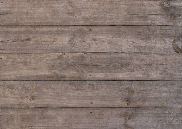 Close up background texture of vintage weathered brown wooden surface with knots and stains - Fotografie, Obrázek