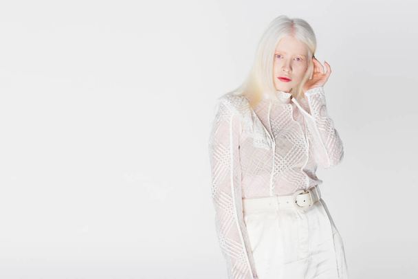 Stylish albino woman looking at camera isolated on white  - Fotó, kép
