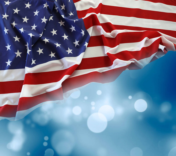 American flag and blue blurred background - Foto, Imagen
