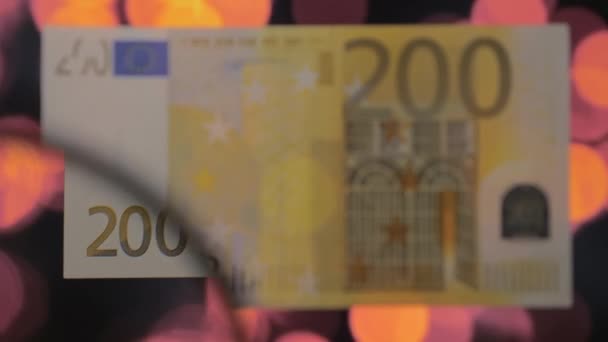 A kép a bankjegyben lévő 200 eurós papírpénzről - Felvétel, videó