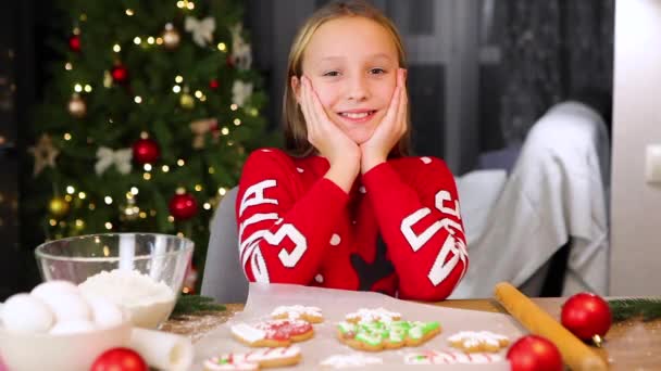 Teenage girl baking christmas gingerbread cookies at home - Footage, Video