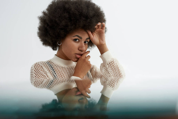 Young pretty black woman with mirror reflection - Fotografie, Obrázek