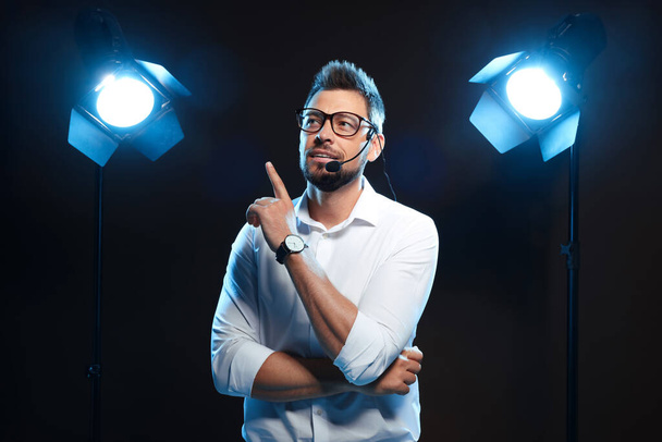 Motivational speaker with headset performing on stage - Fotó, kép