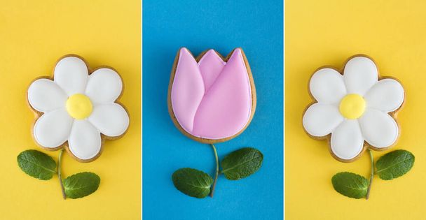 Creatieve collage van peperkoek in de vorm van bloemen op de gekleurde achtergrond. achtergrond. Bovenaanzicht. Voorjaar achtergrond. - Foto, afbeelding