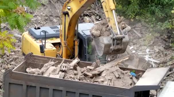 Demolition of ancient historical buildings, excavator breaks down an old vintage house. construction of new buildings on the site of abandoned housing concept. Urban Renewal 4k High quality video - Footage, Video