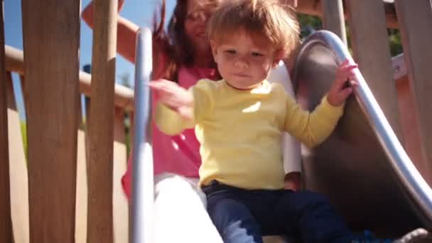 Mother and Son Go Down Slide - Footage, Video